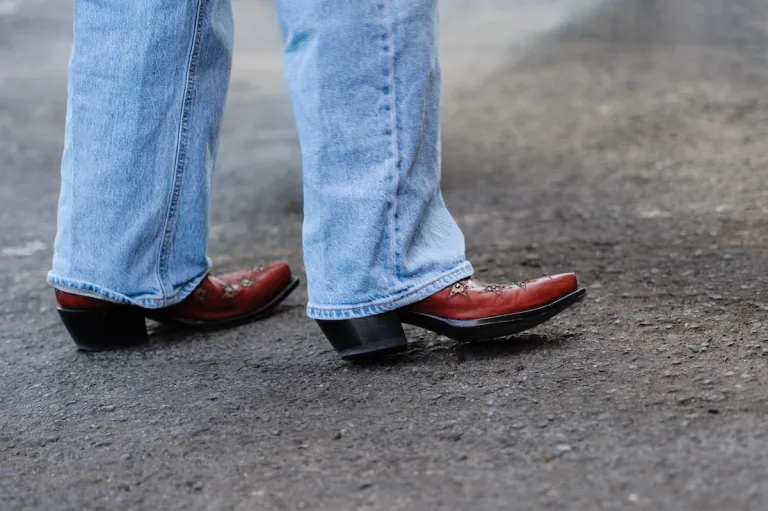 close up light jeans red cowboy boots | MercerOnline
