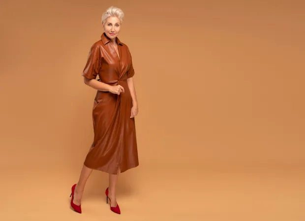 mature woman brown leather dress red heels | MercerOnline